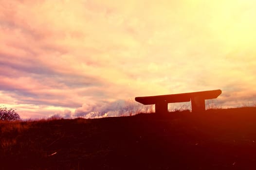 Bench and sundown. Alone bench at sunset.