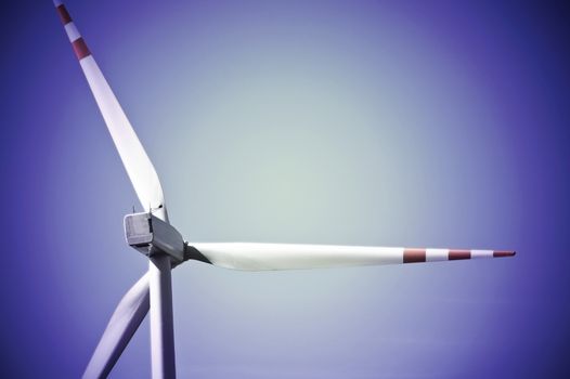 Wind turbine against blue sky. Windmill alternative ecological energy.