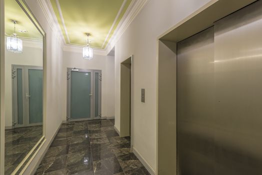 entrance of a residential building with an elevator