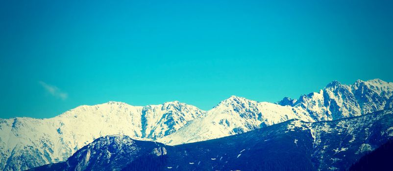 Nature in mountains. Panorama of mountains peaks in Tatra Mountains.