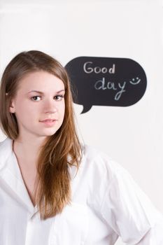 Girl in a white shirt on the background of the inscription a good day