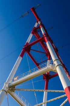 supports of high-voltage power lines against the blue sky