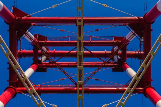 supports of high-voltage power lines against the blue sky