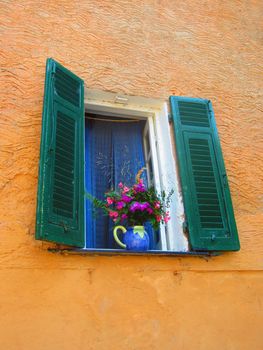 Window in Italy with flowers                             