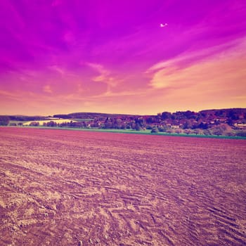 Small German Town Surrounded by Fields with Seedlings at Sunset, Instagram Effect