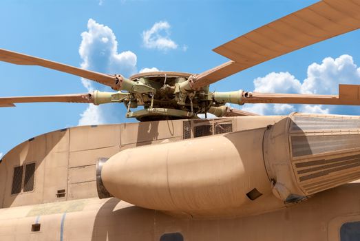 Military helicopter rotor with blue sky background