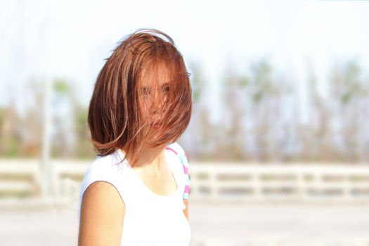 Lady with her hairstyle and hair cover her face