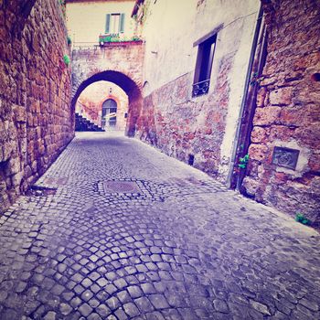 Narrow Street with an Arch in the Medieval Italian City, Instagram Effect