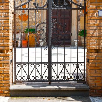 Steel Gate  Leading into the Courtyard of Old Italian House