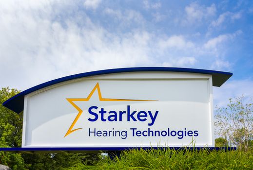 EDEN PRAIRIE, MN/USA - August 13, 2015: Starkey Hearing Technologies headquarters and Sign. Starkey Hearing Solutions is a global manufacturer of hearing aid devices.