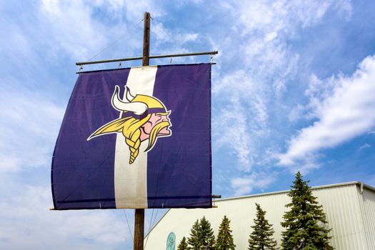 EDEN PRAIRIE, MN/USA - August 13, 2015: Minnesota Vikings practice facility and flag. The Minnesota Vikings are a professional American football team based in Minneapolis, Minnesota.
