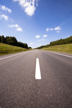 paved road in the summer time