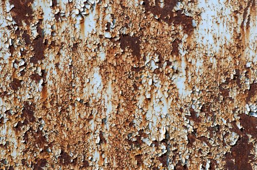 Rusted metallic surface with flaky paint