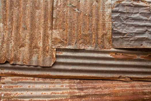 A rusty iron metal fence close up/ Zinc wall