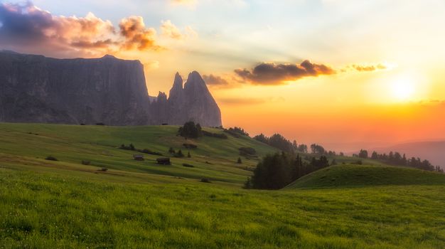 Schlern mountain with pasture at sunset, South Tyrol, Italy