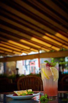 Refreshing homemade lemonade with raspberries and french mint