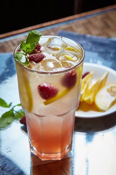 Refreshing homemade lemonade with raspberries and french mint