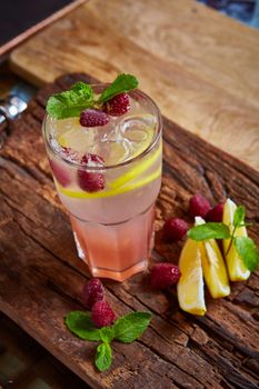 Refreshing homemade lemonade with raspberries and french mint