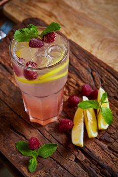 Refreshing homemade lemonade with raspberries and french mint