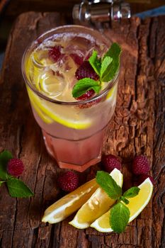 Refreshing homemade lemonade with raspberries and french mint