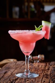 Watermelon frozen cocktail with copy space on wooden background