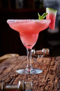 Watermelon frozen cocktail with copy space on wooden background