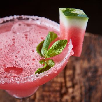 Watermelon frozen cocktail with copy space on wooden background