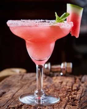 Watermelon frozen cocktail with copy space on wooden background