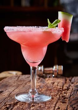 Watermelon frozen cocktail with copy space on wooden background
