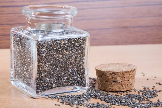organic chia seeds in a glass bottle cork