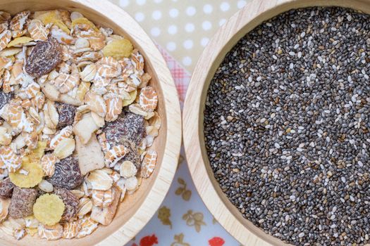 Muesli and chai seed in wooden bowl