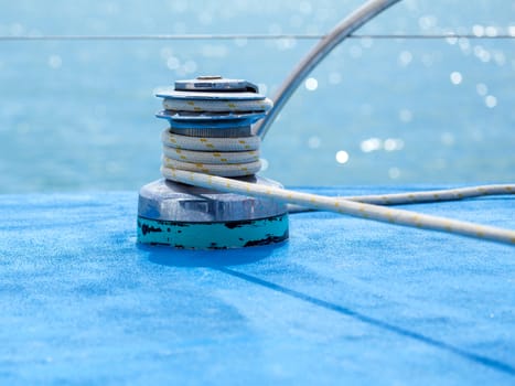 Sailboat winch and rope yacht detail with selective focus.