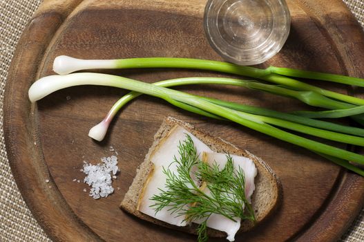 Sandwich with salted lard on rye bread and vodka view from above