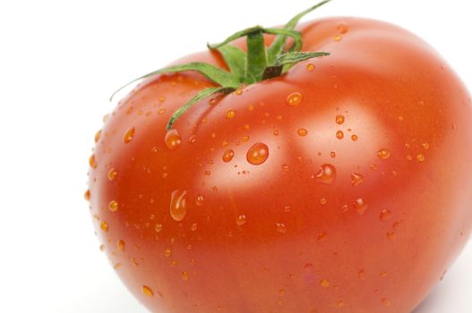 Ripe organic tomato close up isolated on white