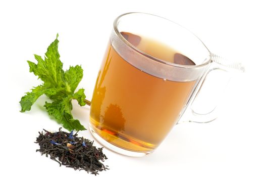 Cup of flavored black tea with mint on white