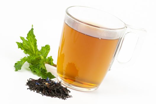 Cup of flavored black tea with mint on white