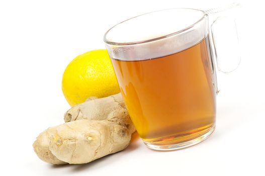 Cup of black tea served with ginger and lemon isolated on white