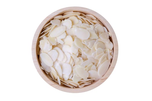 Almond slice in wooden bowl, isolate white background.