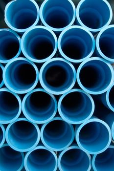 Group of blue pipe pvc in stock.