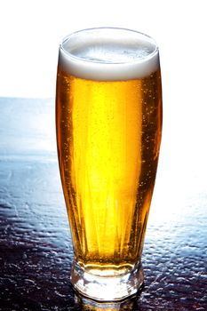 Glass full of beer over white background. Alcohol conceptual image