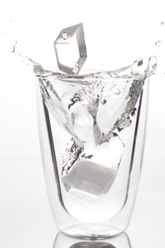 Ice drop, falling to glass of drinking water