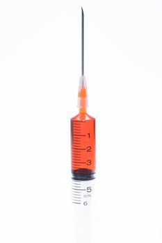 red vaccine syringe on white background