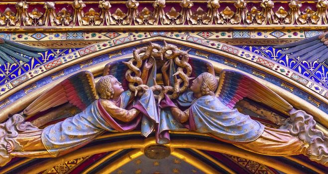 Angels Wood Carvings Cathedral Saint Chapelle Paris France.  Saint King Louis 9th created Sainte Chappel in 1248 to house Christian relics, including Christ's Crown of Thorns.  Stained Glass created in the 13th Century and shows various biblical stories along wtih stories from 1200s.