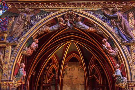 Angels Wood Carvings Arch Cathedral Saint Chapelle Paris France.  Saint King Louis 9th created Sainte Chappel in 1248 to house Christian relics, including Christ's Crown of Thorns.  Stained Glass created in the 13th Century and shows various biblical stories along wtih stories from 1200s.