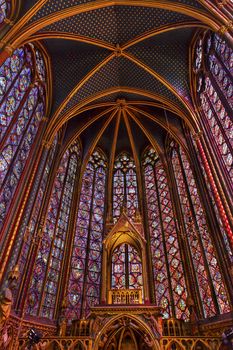 Stained Glass Saint Chapelle Cathedral Paris France.  Saint King Louis 9th created Sainte Chappel in 1248 to house Christian relics, including Christ's Crown of Thorns.  Stained Glass created in the 13th Century and shows various biblical stories along wtih stories from 1200s.