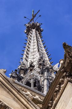 Cathedral Spire Statues Gargoyles Saint Chapelle Paris France.  Saint King Louis 9th created Sainte Chappel in 1248 to house Christian relics, including Christ's Crown of Thorns. 