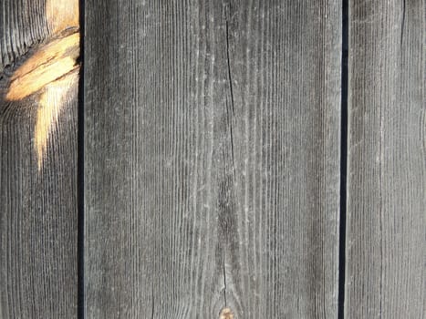 Wooden background from boards of knotty wood. Old boards.