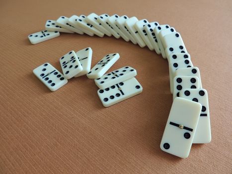 The Falling Domino Prinsiple. The Domino principle. The game of dominoes.