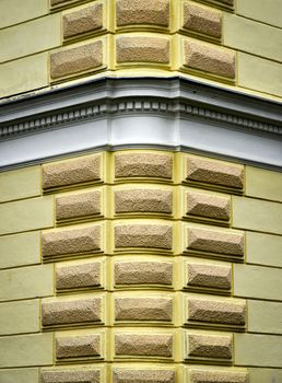 background or texture yellow decorated corner of a historic building