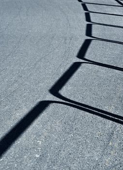 abstract background or texture shadow on asphalt road railings